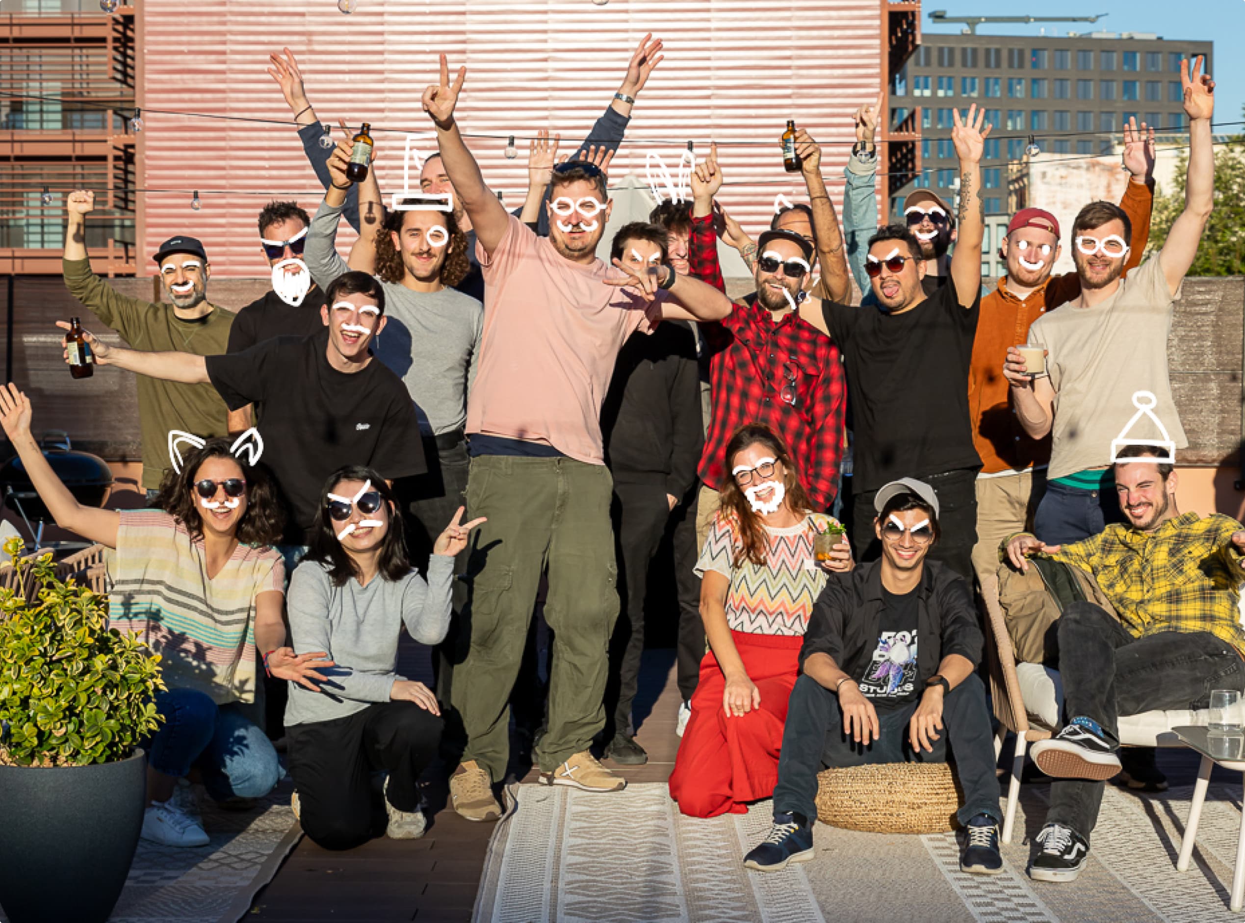 The Bora Studios team together on a rooftop